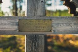 Wooden orthodox memorial cross in Ilomantsi battleground trail.