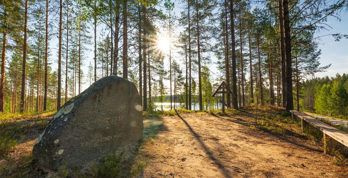 Taivallampi terrain and a memorial plaque in stone
